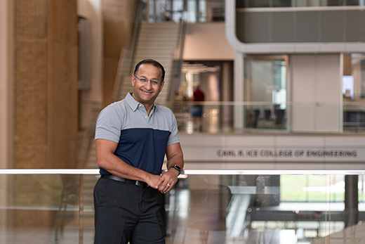 Professor Natarajan stands in engineering building at K-State